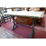 A 20th century cast iron table with marble top, H.73 W.127 D.53cm