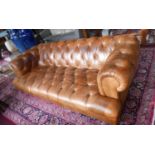 A John Lewis tan leather chesterfield sofa