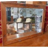 A pine framed mirror with bevelled plate, 89 x 63cm