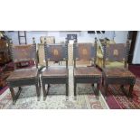 A set of four 19th century French carved oak dining chairs with original leather having impressed