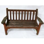 A weathered teak garden bench, H.81 W.130 D.60cm