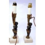 A pair of 19th century bronze candlestick holders, later converted to electricity