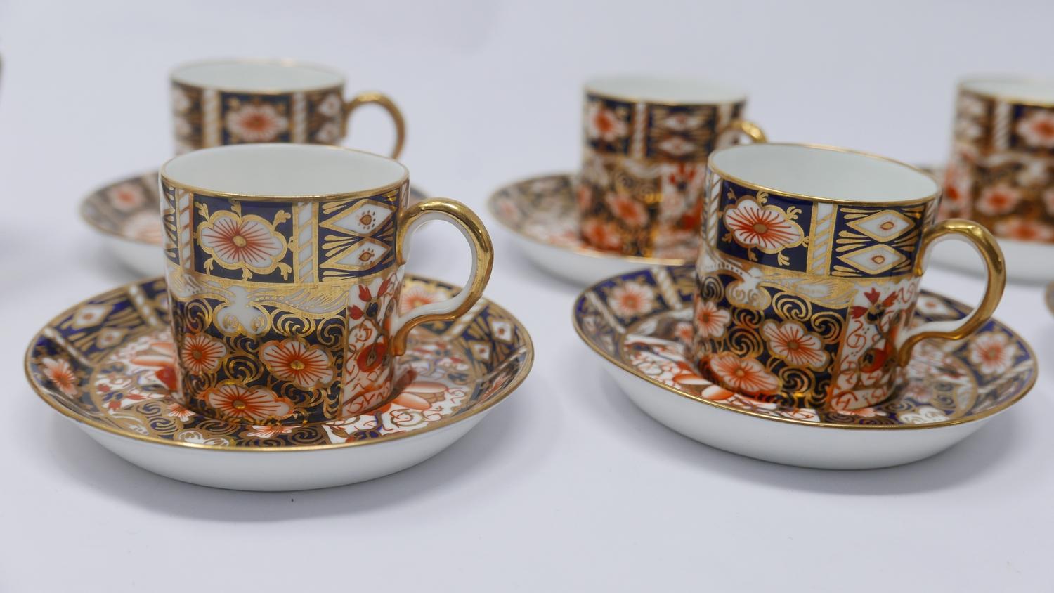 A set of six Royal Crown Derby coffee cups and saucers together with two small vases and a pot - Image 2 of 5