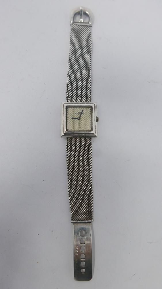 WITHDRAWN- A 1970's Roy King silver wristwatch, square textured dial signed, the textured silver