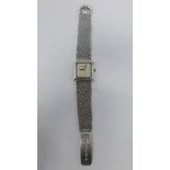 WITHDRAWN- A 1970's Roy King silver wristwatch, square textured dial signed, the textured silver