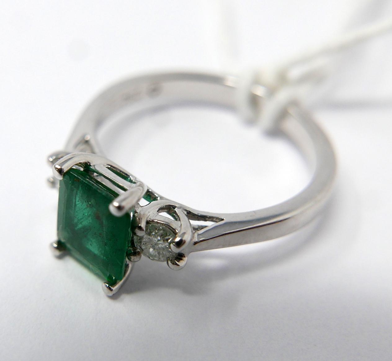 An 18ct white gold, emerald and double diamond ring, centrally set with a stepped-cut, - Image 2 of 2