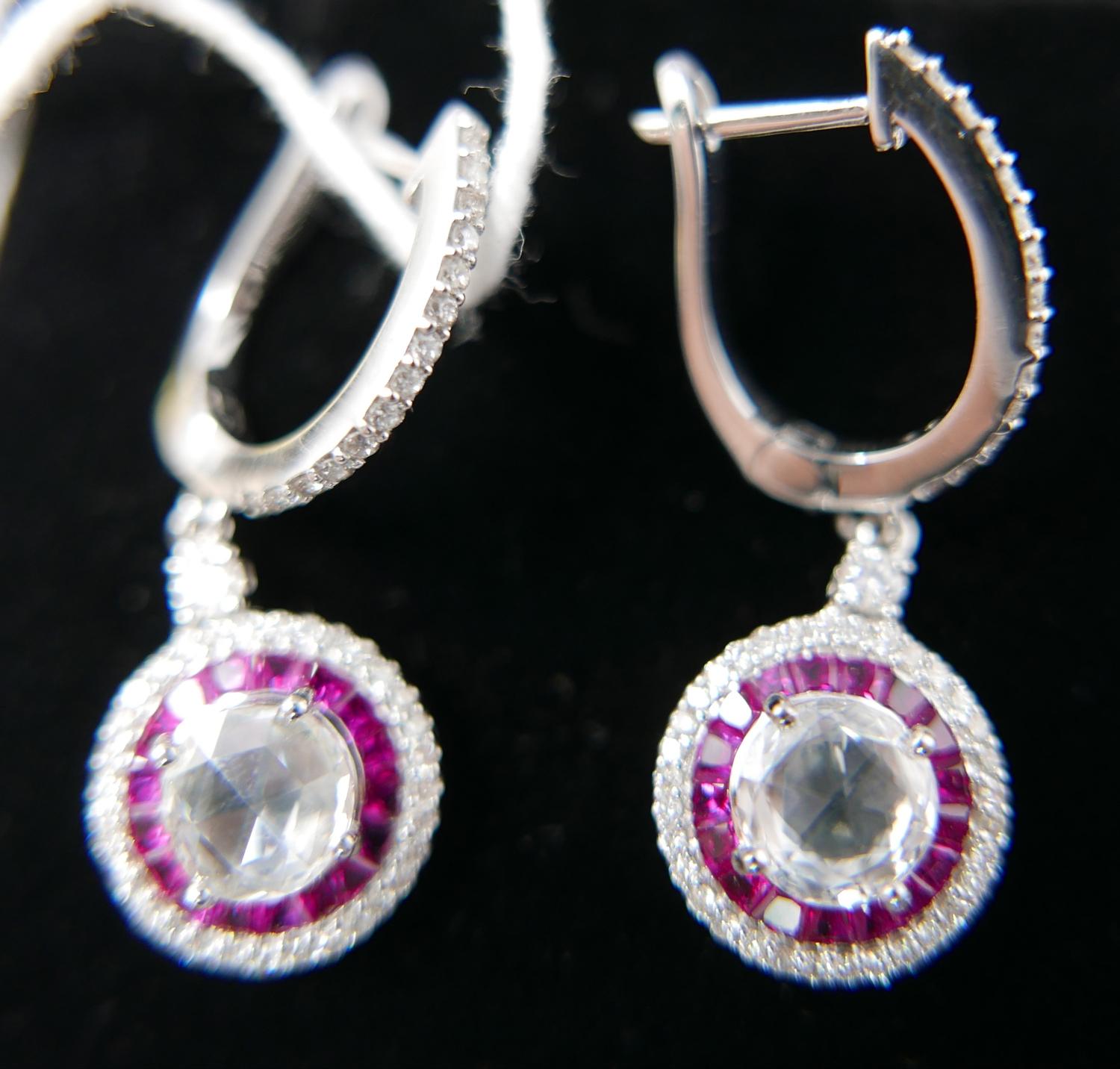 A boxed pair of 18ct white gold, ruby and diamond drop earrings, each earring set with a central - Image 2 of 4