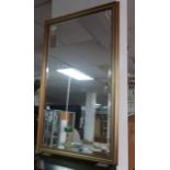 A gilt framed mirror with bevelled plate, 132 x 79cm