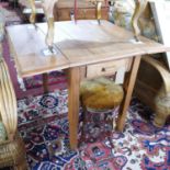 A 20th century pine drop leaf table with drawer