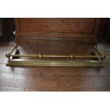 A 19th century brass fire fender, H = 17cm W = 136cm D = 37cm