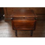 An early 19th century mahogany campaign commode with brass carrying handles and removable legs,