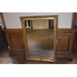 A contemporary gilt framed rococo style wall mirror, H = 106cm W = 75cm