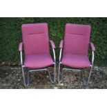 A pair of tubular chrome framed boardroom chairs, H = 96cm