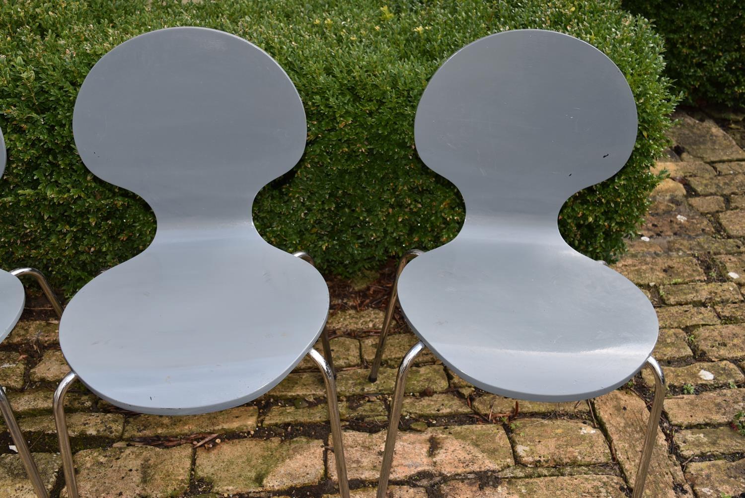 A set of four grey stacking chairs, H = 82cm W = 44cm D = 45cm - Image 3 of 4