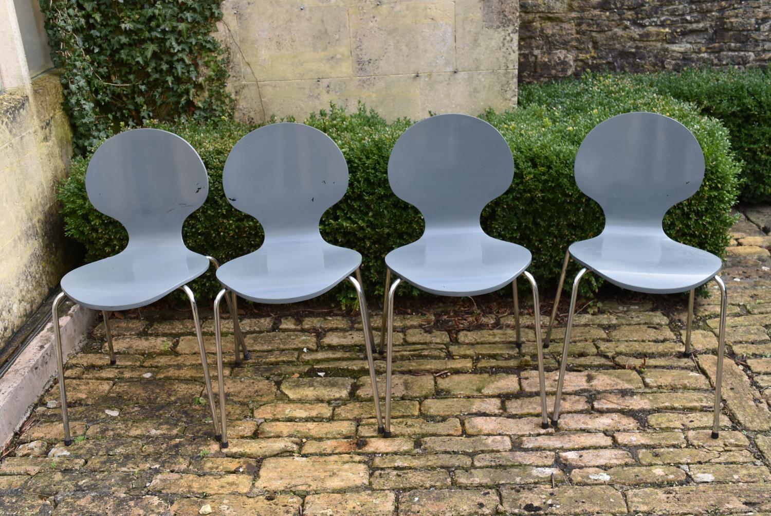 A set of four grey stacking chairs, H = 82cm W = 44cm D = 45cm