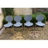 A set of four grey stacking chairs, H = 82cm W = 44cm D = 45cm