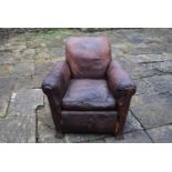 A leather club armchair, H = 79cm W = 89cm D = 91cm (general allover worn condition)