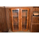 An Art Deco burr walnut display cabinet with leaded glazed doors, H = 126cm W = 110cm D = 34cm