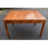 A 1950's walnut dining table with extra leaf fitted underneath, H = 76cm W = 132cm D = 98cm When