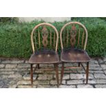 A pair of Windsor wheelback dining chairs, H = 83cm