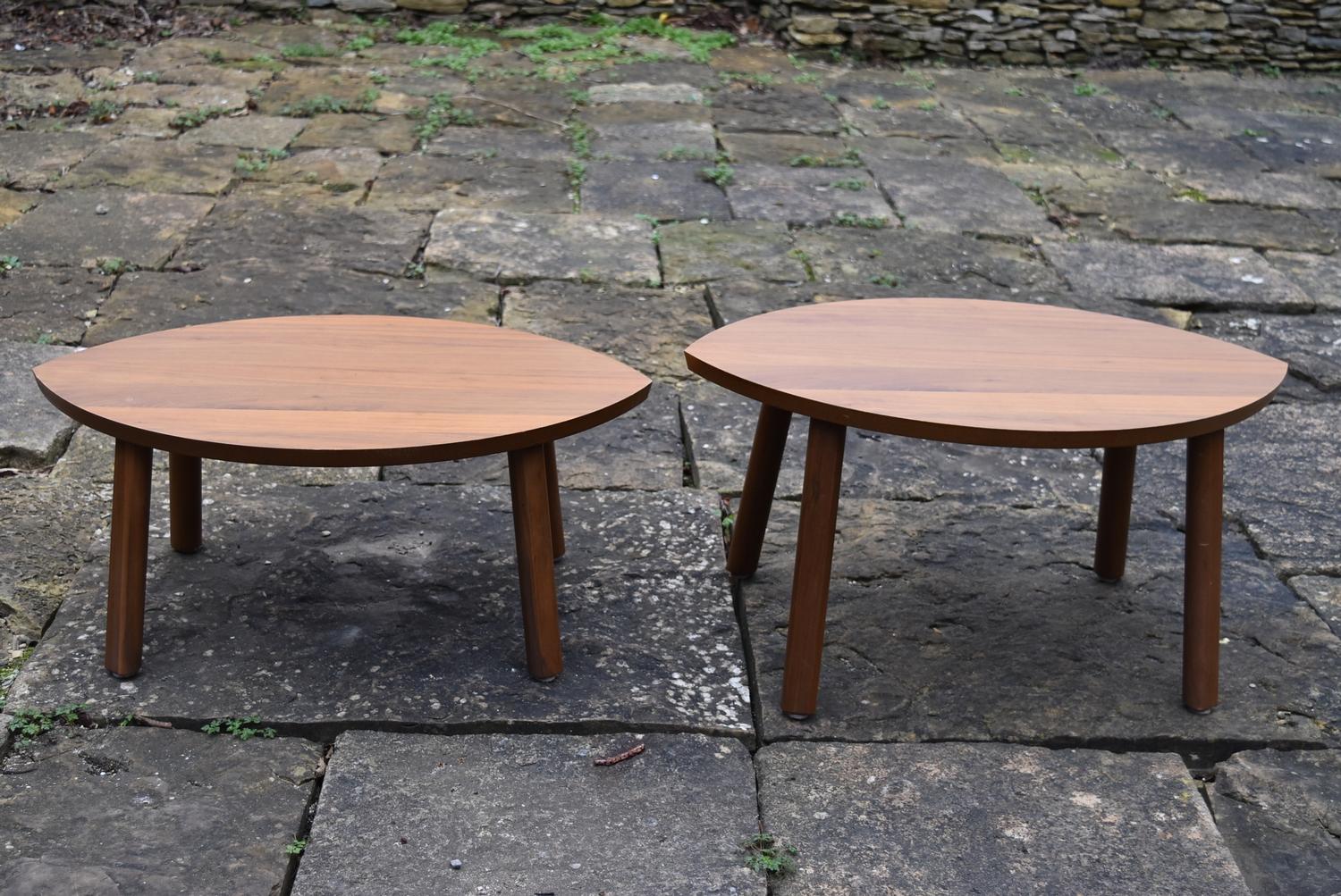 A pair of contemporary low hardwood tables, H = 37cm W = 73cm D = 49cm