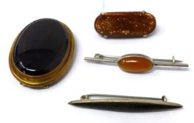 Four 19th century brooches: a yellow meatl, oval banded agate example, a silver and goldstone