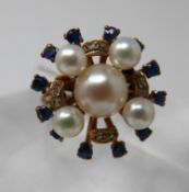 A 9ct yellow gold, sapphire pearl and diamond cluster ring, set with 12 outer sapphires, 8