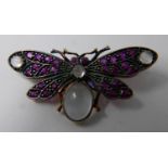 An antique yellow gold butterfly brooch studded with rubies and moonstone cabochons 1.5 x 3.5cm, 3.