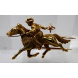 An 18ct yellow gold horse and rider brooch with ruby eye to horse, 2.5 x 4cm, 9.1g