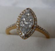 An 18ct yellow gold cluster, marquise-shaped diamond ring (0.60 carats total), Size: K 1/2, 2.9g.