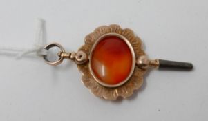 A 19th century, yellow gold and carnelian-set watch fob pendant, 5 x 2.5cm.