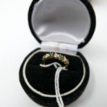 A boxed, 14ct yellow gold diamond and emerald ring, aternately set with a total of twelve emeralds