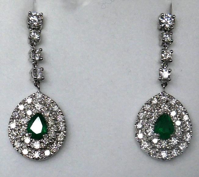 A boxed pair of 18ct white gold emerald and diamond cluster drop earrings, each earring suspended by