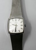 A Gentleman's Josmar, stainless steel watch, with a square shaped, silvered dial and bar numerals,