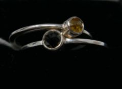 Two boxed, sterling silver rings set with one faceted yellow and one black diamond, Sizes: P & Q 1/