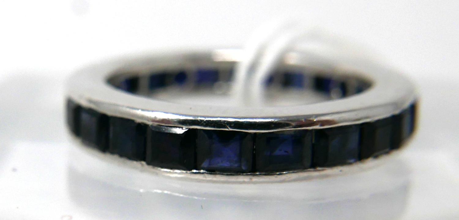 An 18ct white gold and callibre-cut sapphire ring composed of 24 natural sapphires in a channel- - Image 2 of 3