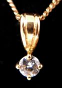 A boxed, 18ct yellow gold, diamond solitaire pendant on an 18ct yellow gold chain, (0.30 carats),