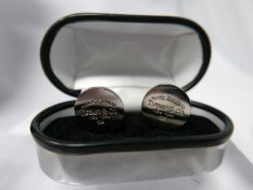 A pair of sterling silver, Tiffany & Co cufflinks, each composed of a circular panel stamped 'please