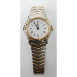 A boxed, Ebel 'Wave' ladies wristwatch in stainless steel and 24ct yellow gold plated, a round,