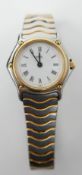 A boxed, Ebel 'Wave' ladies wristwatch in stainless steel and 24ct yellow gold plated, a round,