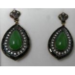 A boxed pair of drop earrings set with a pear-drop, translucent green jade cabochon surrounded by
