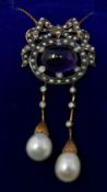 A boxed, yellow gold double-drop necklace with a central cabochon amethyst set within a mount of