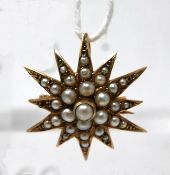 A 9ct yellow gold, Victorian star-shaped pendant studded with 30 cream coloured pearls, 2.3 x 2.3cm,