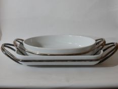 Two large Sambonet, silver-plated and ceramic serving dishes, Larger: 8.5 x 55cm, Smaller: 8 x 44cm.