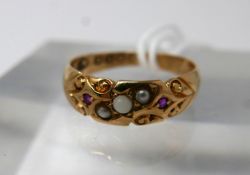 An 18ct yellow gold, Victorian, ruby and pearl ring with carved detailing, Size: J 1/2, 2.3g