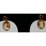 A pair of 19th century, 18ct yellow gold, faceted citrine drop earrings, each earring set with a