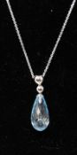A boxed 9ct white gold and faceted blue topaz drop pendant on 9ct white gold chain, L: 44cm,