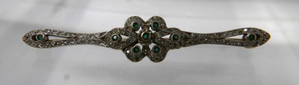 A 19th century, 18ct yellow gold, platinum, diamond and emerald brooch sey with 9 emeralds and