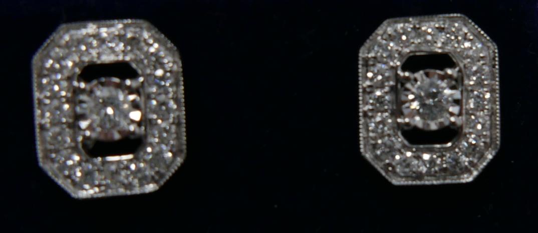 A pair of 18ct white gold and diamond stud earrings (0.50 carats), each earring set with a central - Image 2 of 3