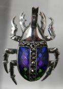 A sterling silver and enamelled stag beetle brooch set with marcasites to the abdomen (blue,